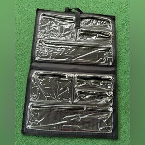 8 zippered clear compartments to store jewelry or other small items.